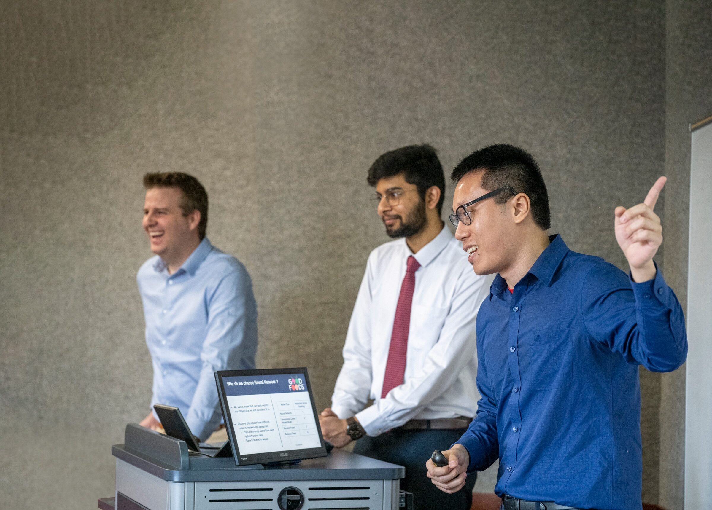 Students presenting behind podium