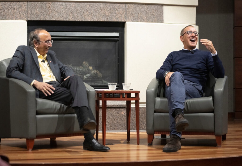 WSB Dean Vallabh "Samba" Sambamurthy and entrepreneur Joe Duran laugh during a WSB Weikel series event.