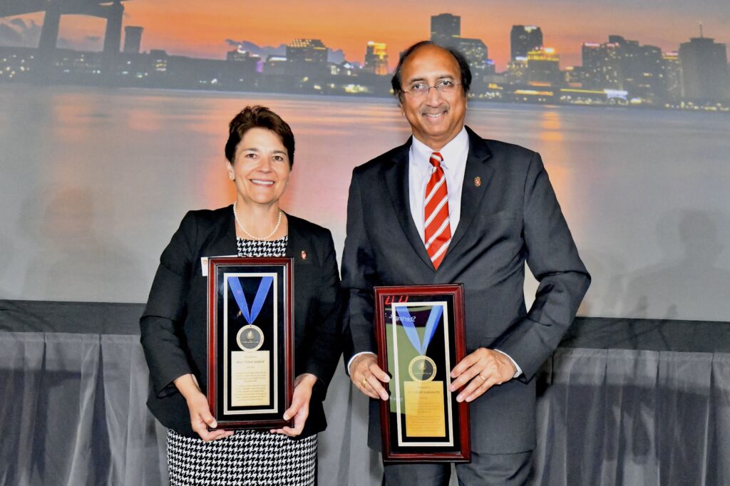 WSB's Blair Sanford and Vallabh Sambamurthy hold awards from the Consortium for Graduate Study in Management.