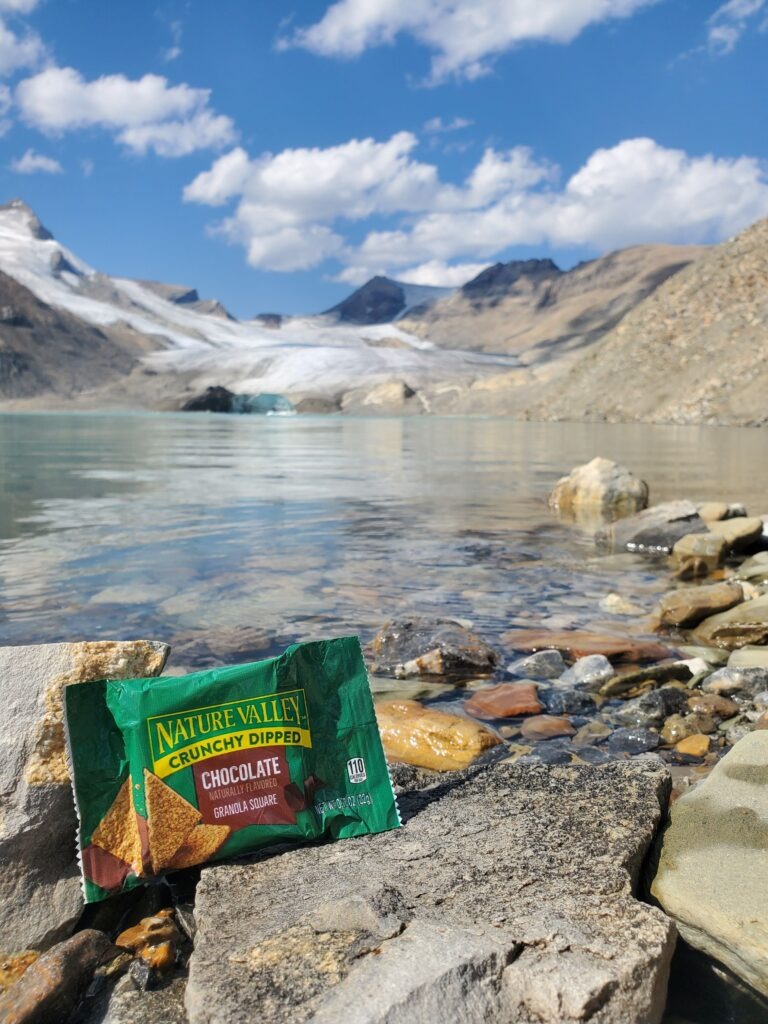 A Nature Valley bar in front of a beautiful mountainous landscape