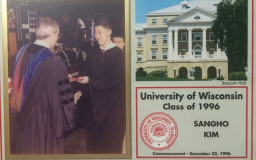 1996 UW Commencement photo of Kim receiving diploma