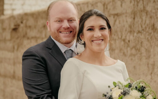 Krueger and his wife posing in their wedding best