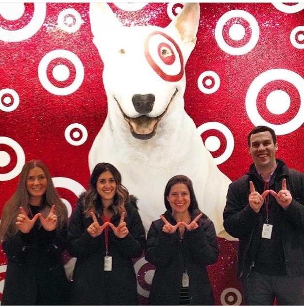Students pose in front of Bullseye at Target