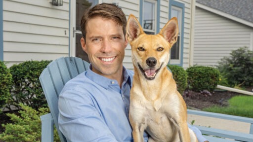 Arek Schmocker posing with his dog, Tanzi