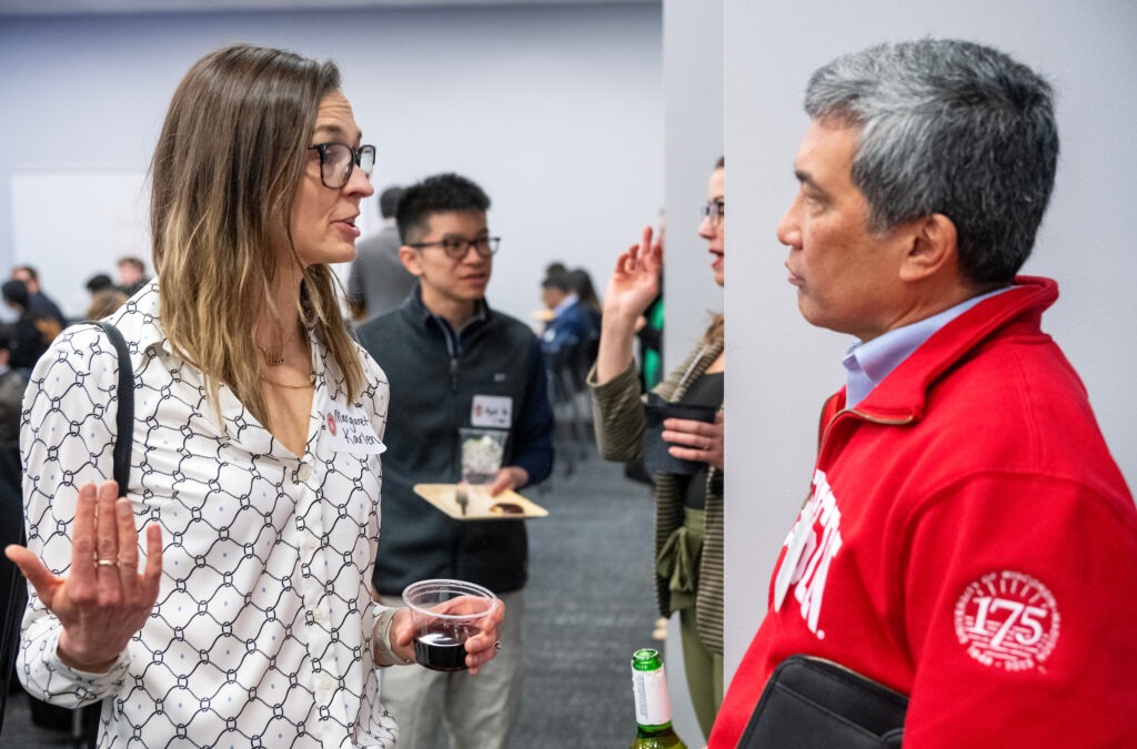 Margaret Karlen (BA ’03) and Emil Ray Sanchez (BBA ’88), chief executive officer of Phoenix International Freight Services, Inc., strike up an engaging conversation at the start of the event.