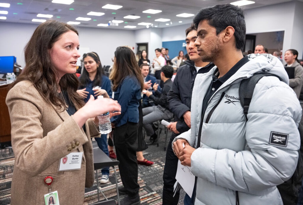 Panelist Kelley Burke connects with a UW–Madison student during the event.