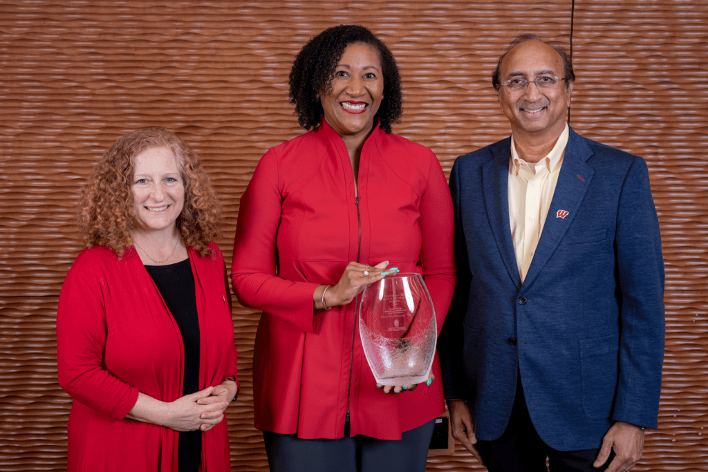 Dorri McWhorter poses with her award alongside Jennifer Mnookin, chancellor of UW–Madison, and Vallabh Sambamurthy, dean of WSB. Photo by Andy Manis