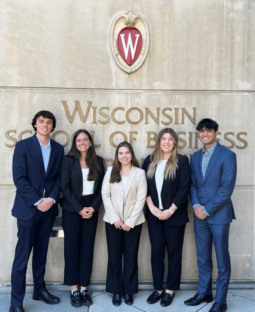 Shane Donohue, Georgia Goff, Brenna Paul, Jessica Pientka, and Krishna Kashian  in front of the Wisconsin School of Business