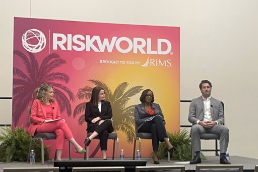 The four panelists of the RiskWorld mentoring session are seated on stage. Christy Kaufman is on left and Fritz Merizon is on right.
