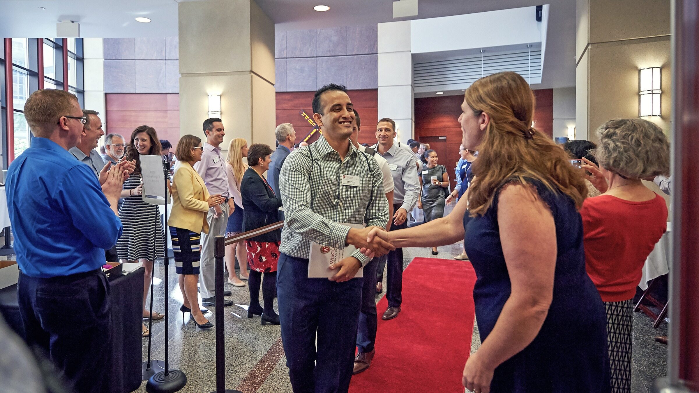 MBA program staff and faculty greet new students at orientation