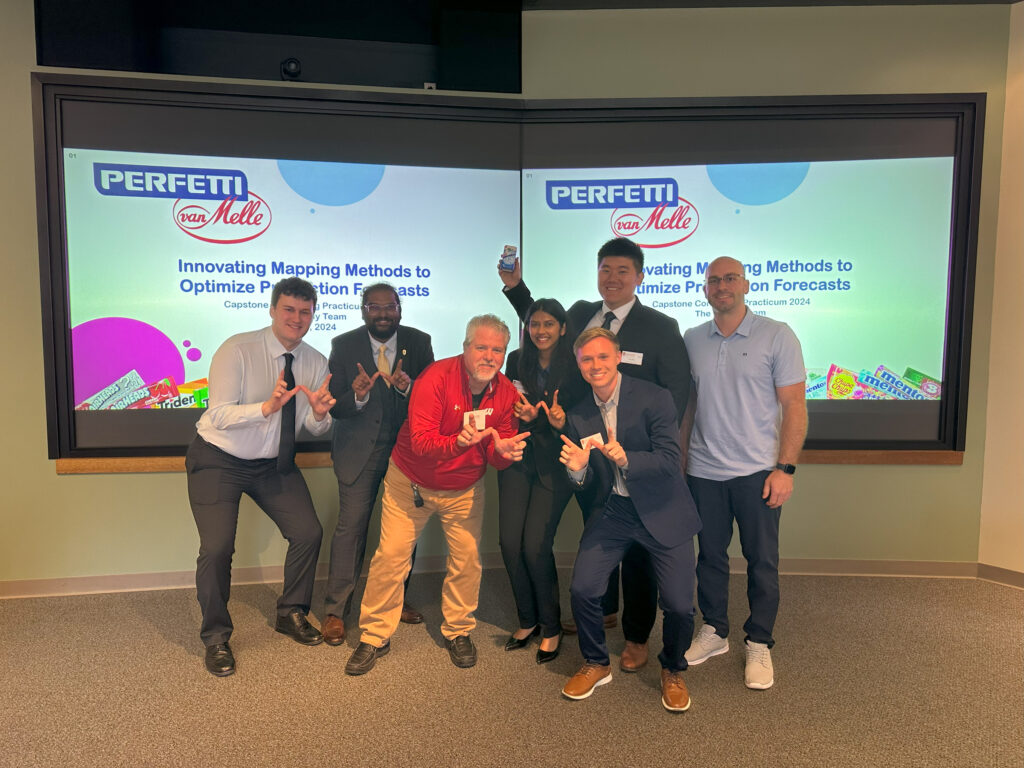 Bill poses with a group of students