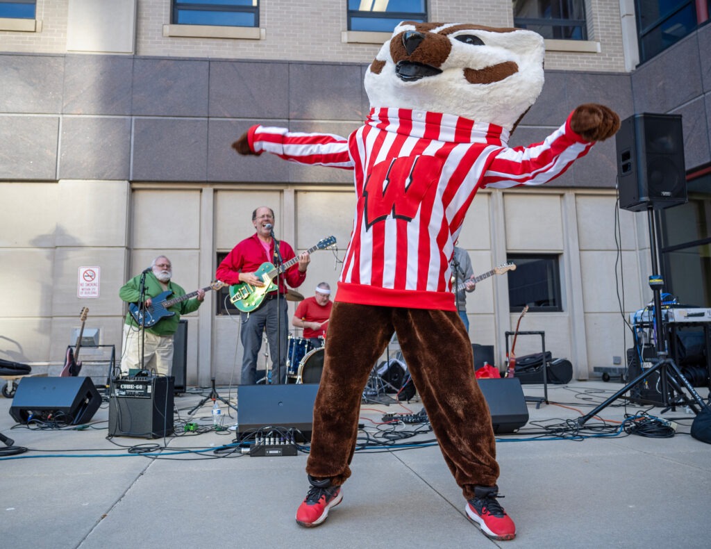 Taking center stage, Bucky Badger jams out to the classic tunes of the Sundogs at WSB’s Homecoming Bash!