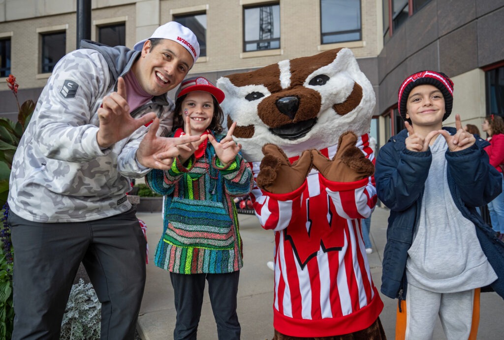 Say cheese! Bucky Badger grabs a photo with Rodrigo Stabio (MBA ’19) and his children, Camila and Nico, in the courtyard.  