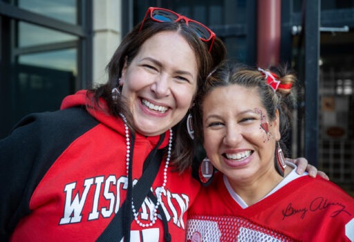 Alum Jeanine Ubl (BBA '02) poses with her cousin Jay King during the Homecoming Bash on Saturday evening, October 26