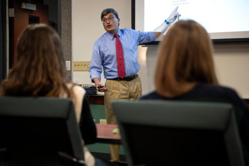 Professor Tarun Kushwaha presents in a Grainger classroom during international week