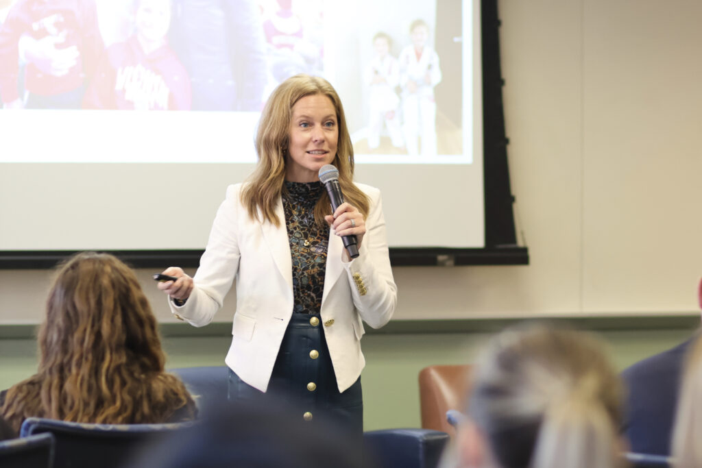 Alumna Sarah Condella gives a presentation to students