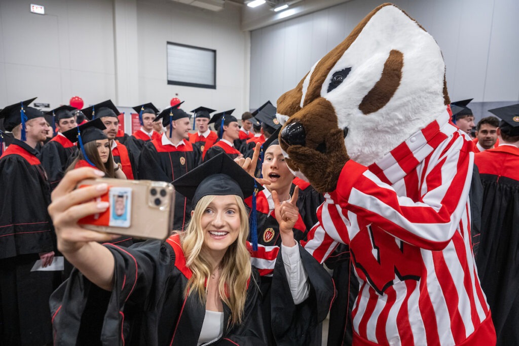 Bucky posing with grads
