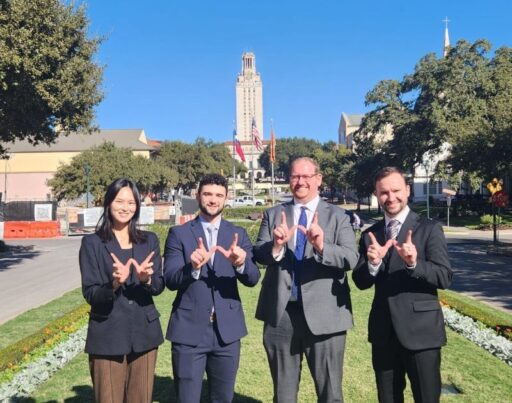 (Left to right) Gin Du, Will Ross, Bryan Zaramba, and Aaron Kindle posing with Wisconsin W's on the UT Austin Campus
