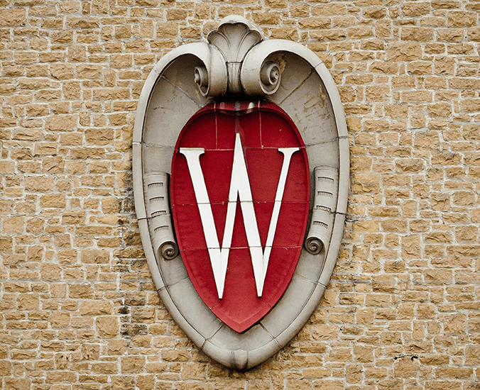 UW Crest on brick wall