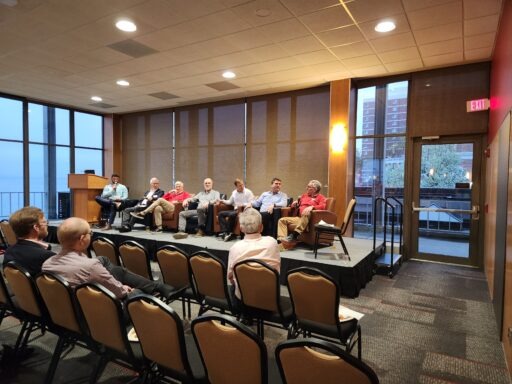 Panelists and real estate club presidents on stage