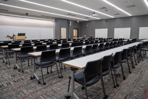 Kellner Hall features a few rows with long tables and chairs.