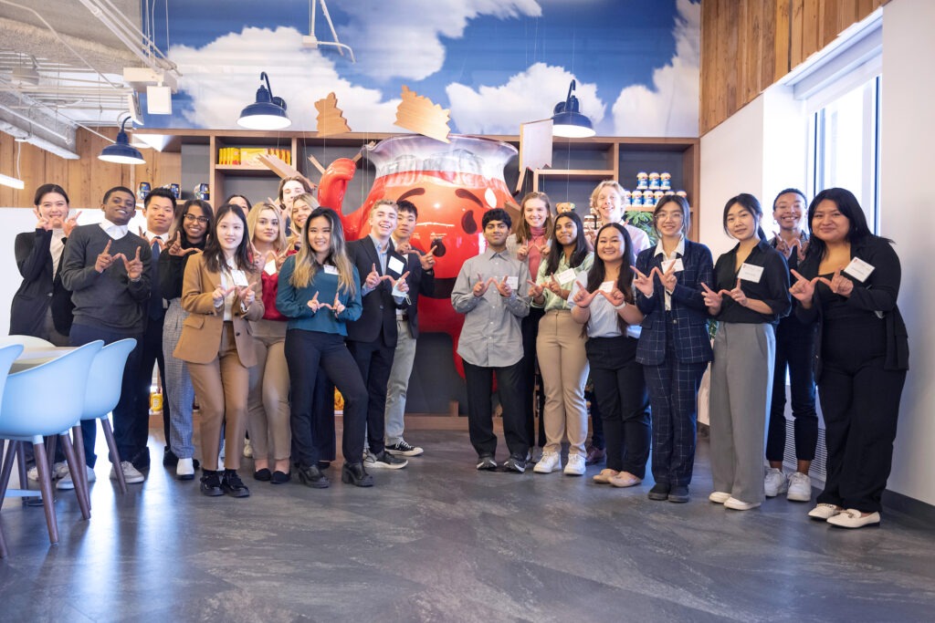 group of students posing in front of Koolaid man