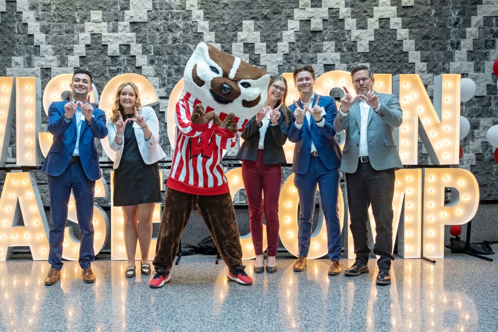 Case competition team posing with Bucky Badger