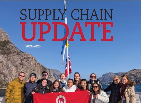 Cover image of Supply Chain Update Magazine. Students holding Wisconsin flag while on a boat in front of rock formations.