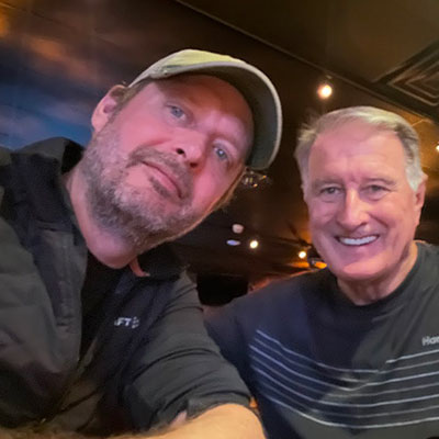 Thomas Edward Linnen poses for a photo with another man.