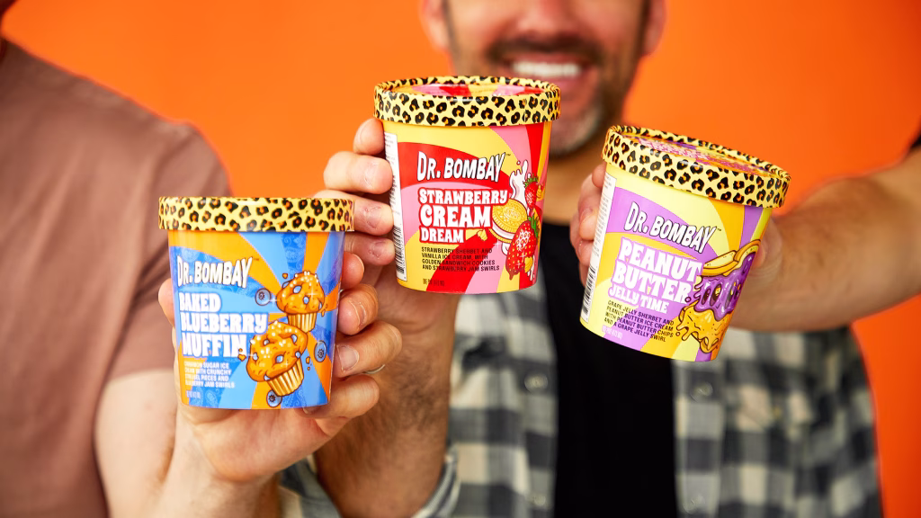 The three Happi Co. cofounders hold up different flavors of their ice cream.