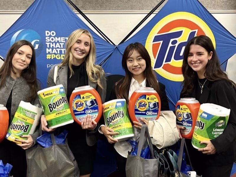 Winners of the P&G Case Competition holding their prizes.