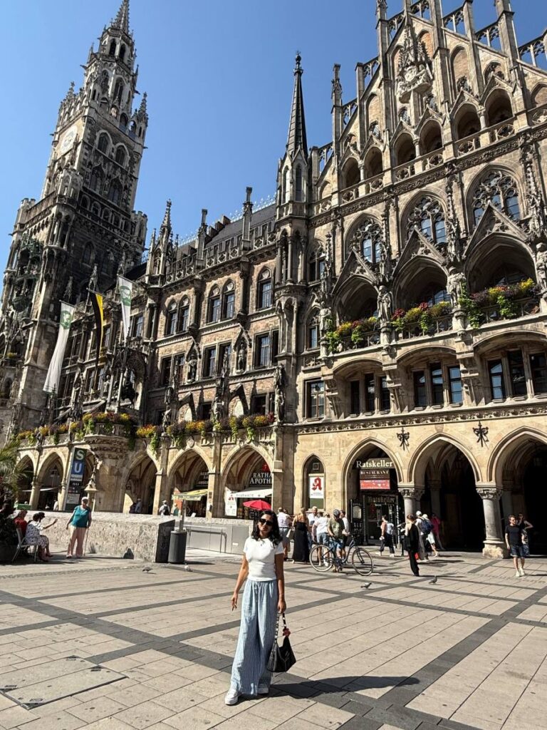 Richa posing in front of architecture while traveling