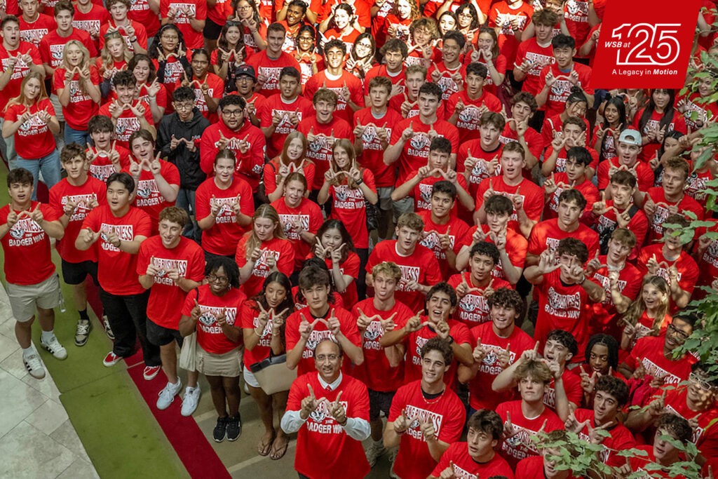 WSB at 125; A Legacy in Motion; Business Badgers pose for a photo at the Wisconsin Institute for Discovery