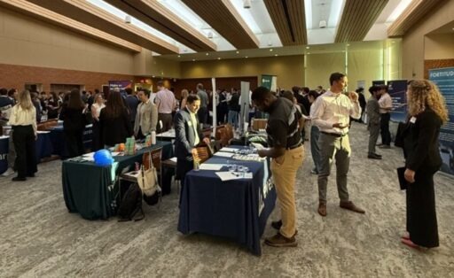 students and company representatives are engaging around skirted tables at the Risk and Insurance Department's Career Fair September 29, 2025