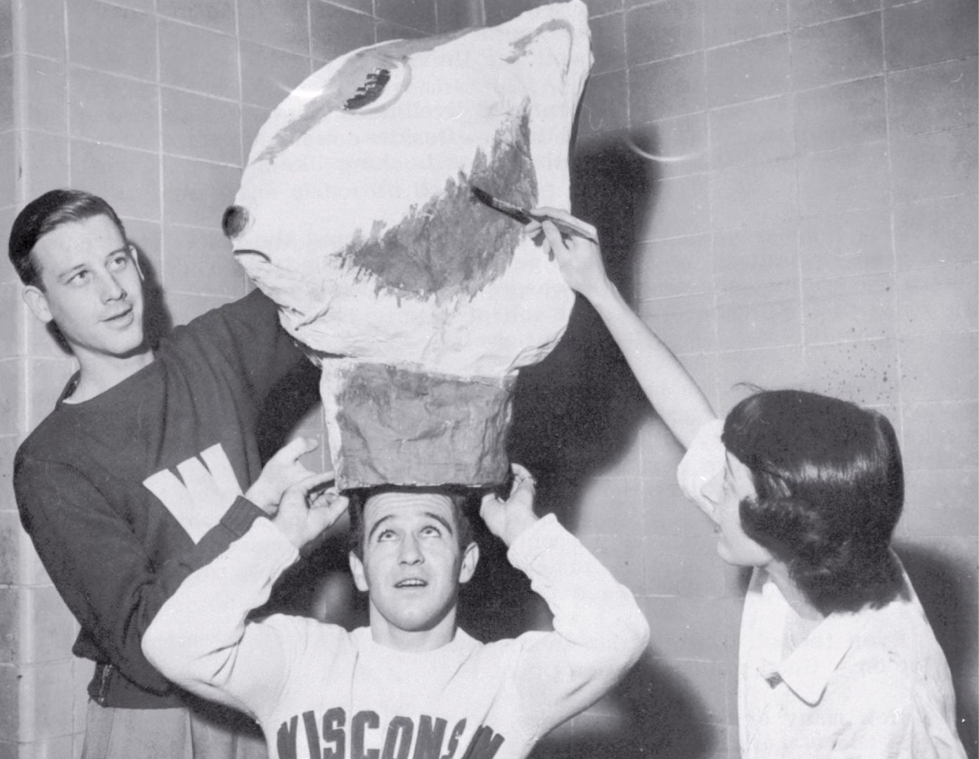 Students, including Bill Sachse, try out their homemade Bucky Badger head.