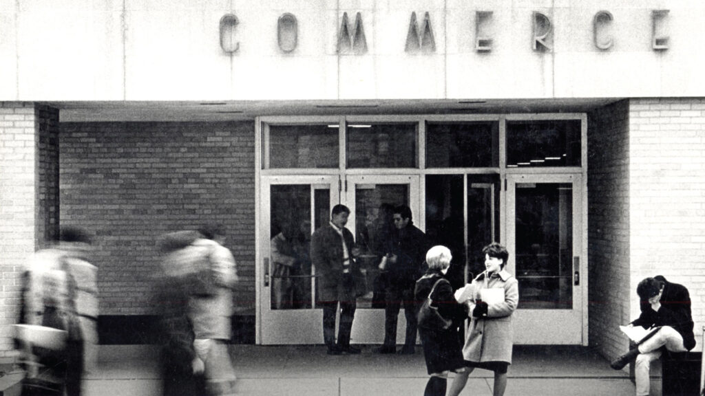 Students enter and exit the Commerce Building.