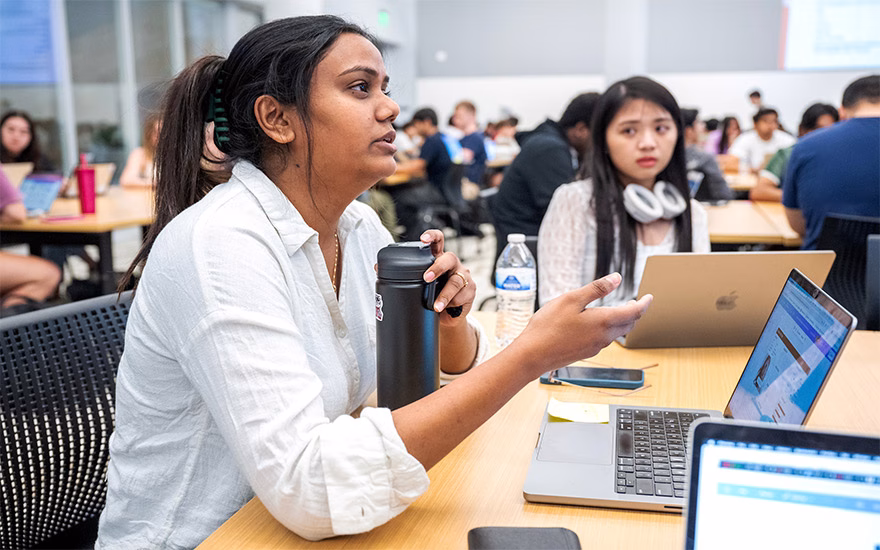 A female student poses a question during the CDIS classroom session.