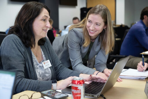 Prof. Kaitlin Daniels works with a student.