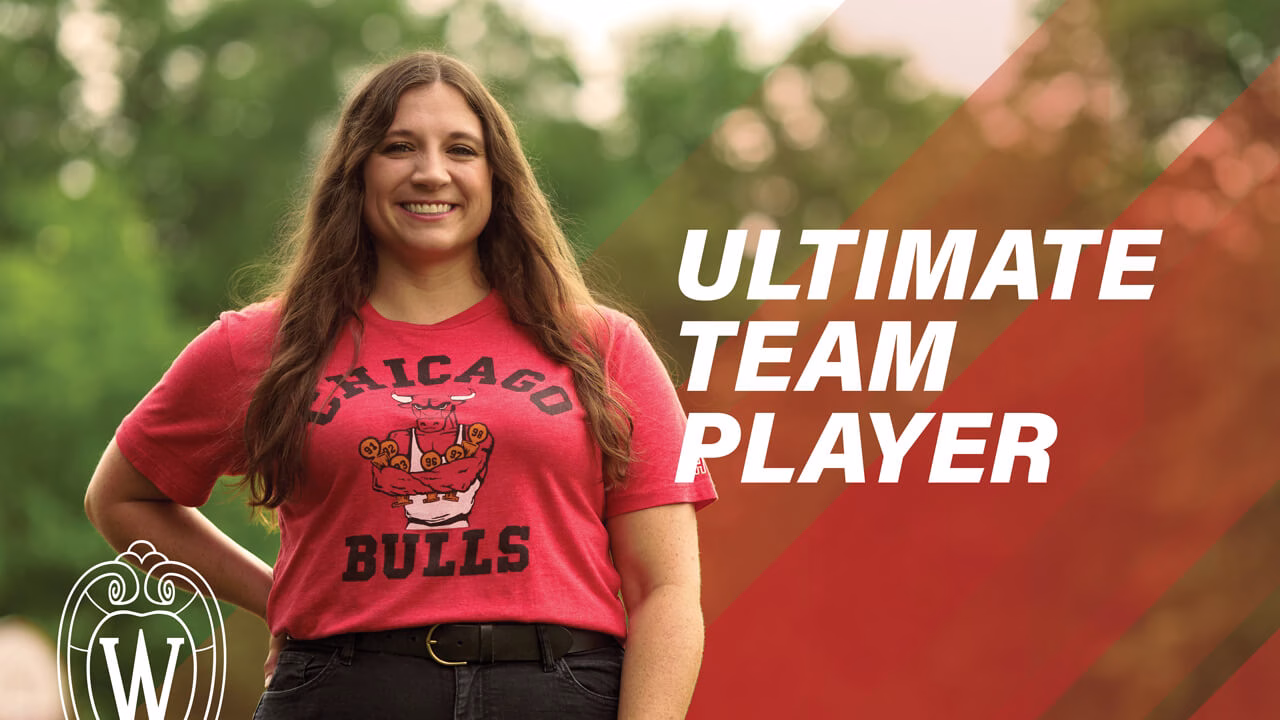 Young woman with brown hair standing outside wearing a Chicago Bulls t-shirt