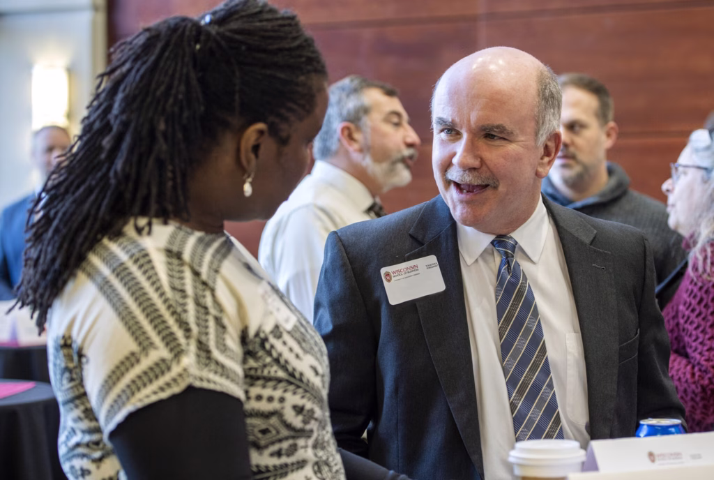 Pacticipants networks during the EEMBA 6th annual corporate connections social event.