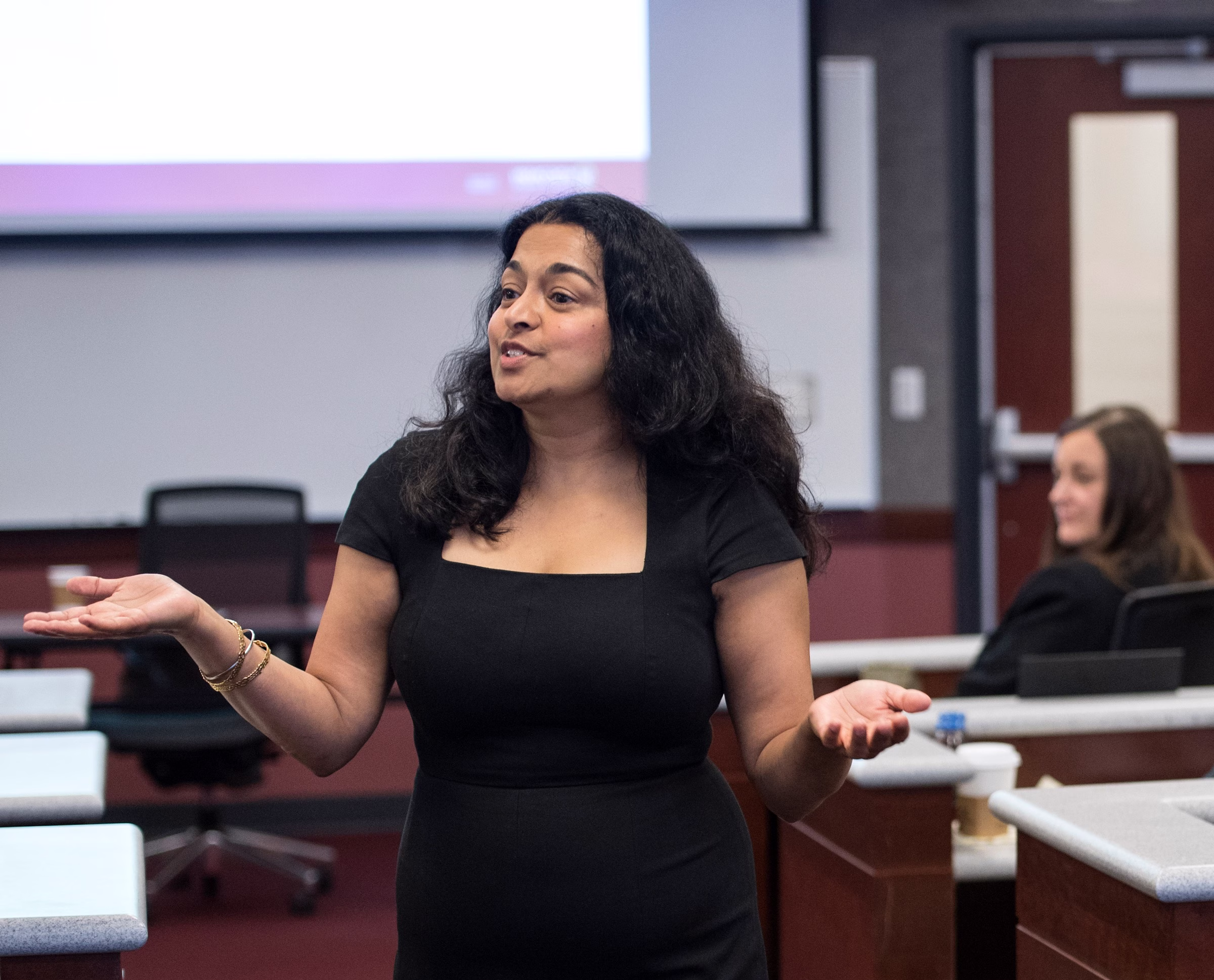 Binnu Palta Hill talking in a classroom.