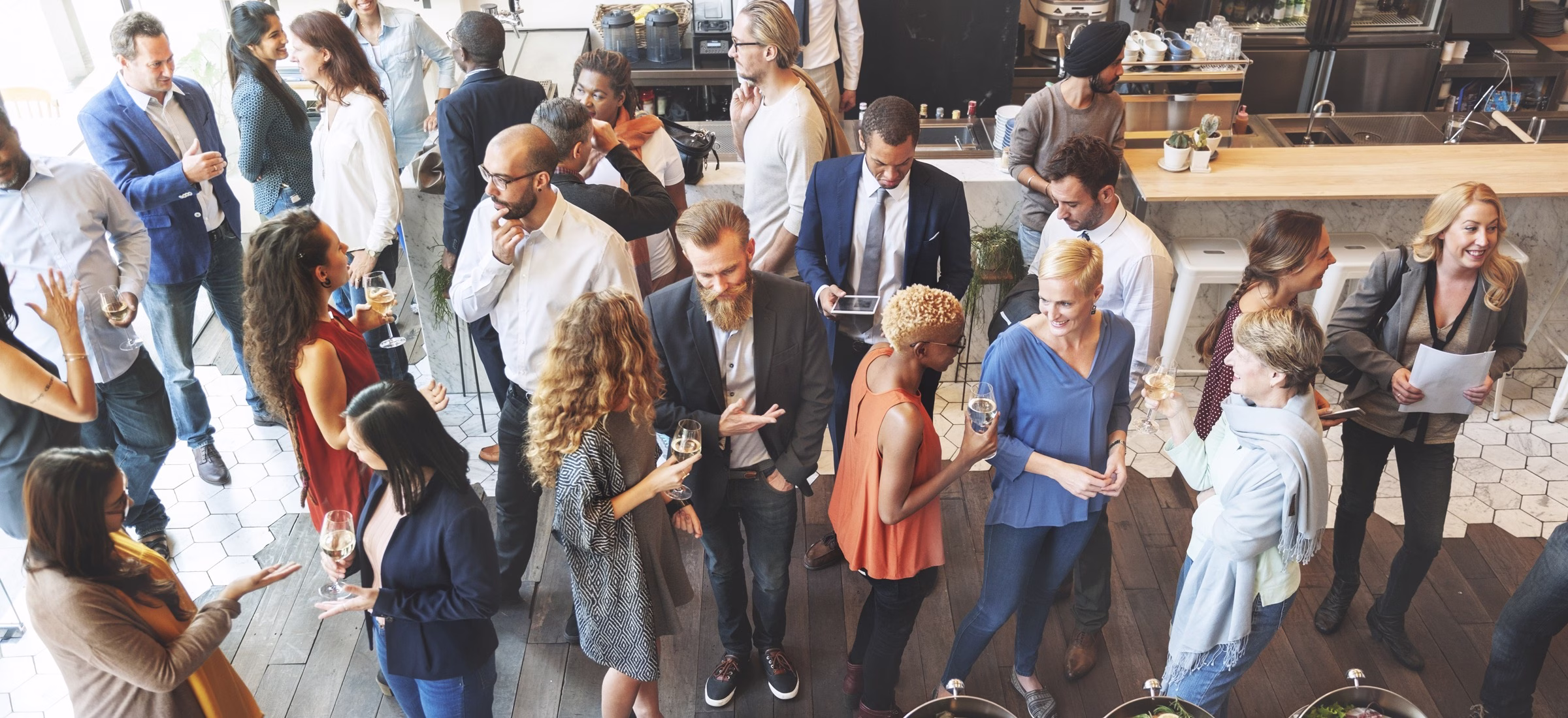 People talking at a networking event.