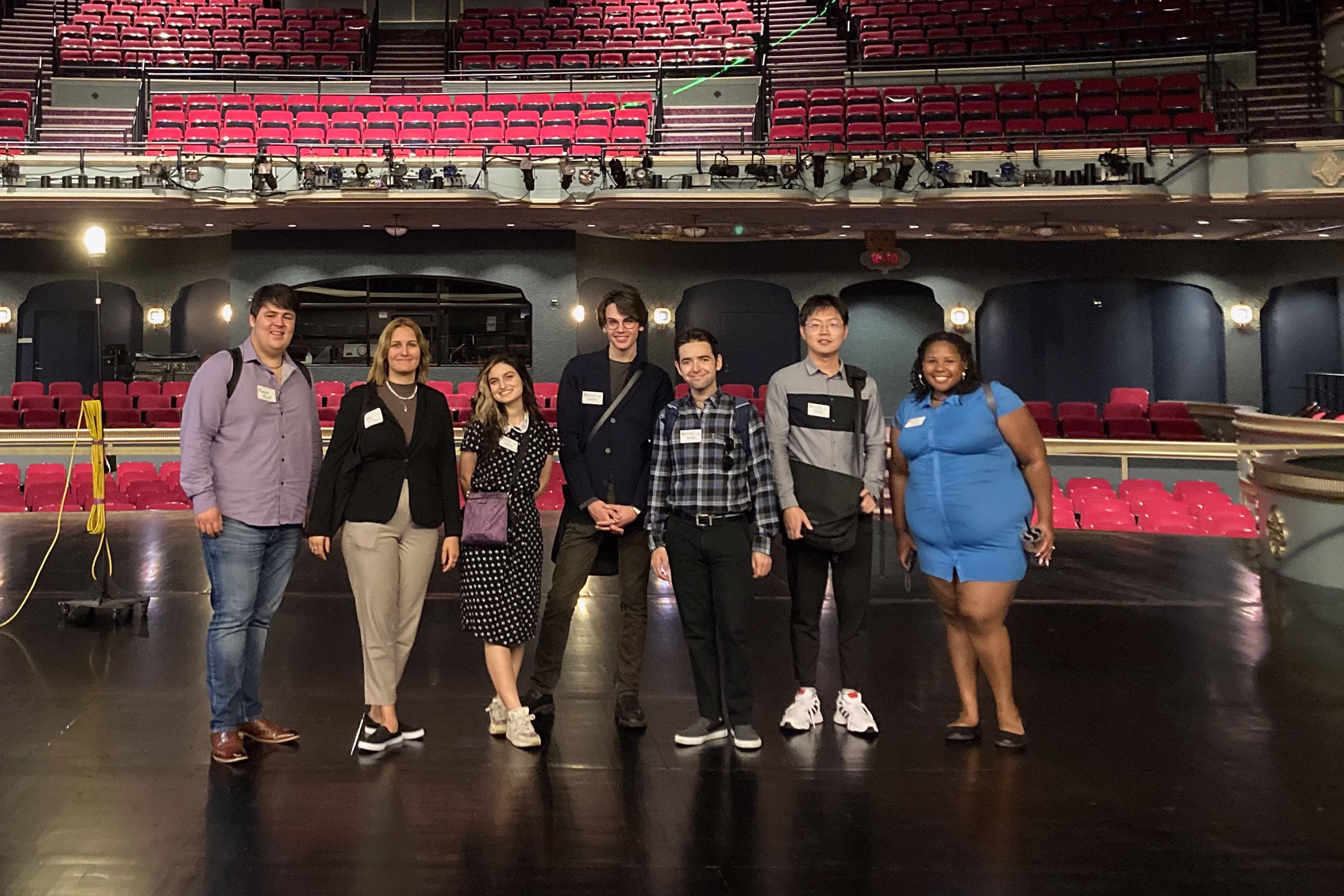 Students standing on a stage at Overture Center.