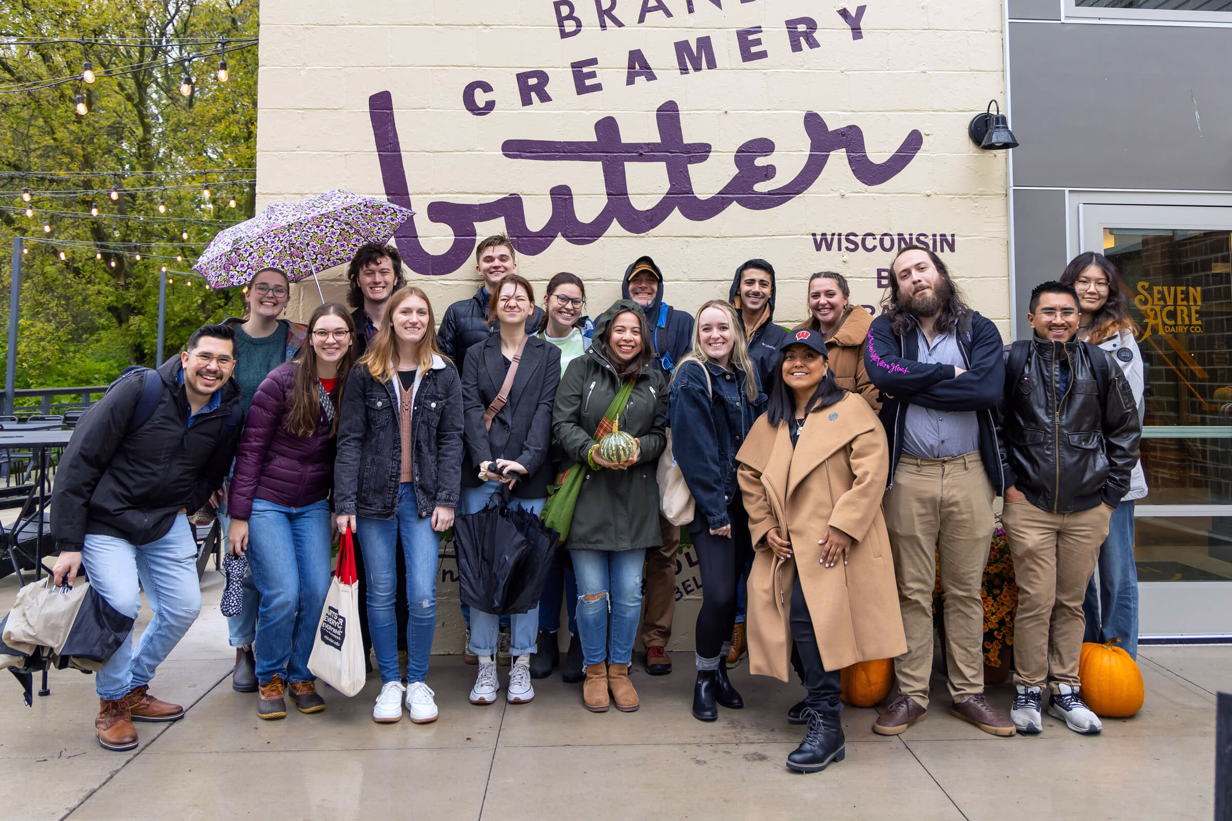 A group of students standing in front of building.