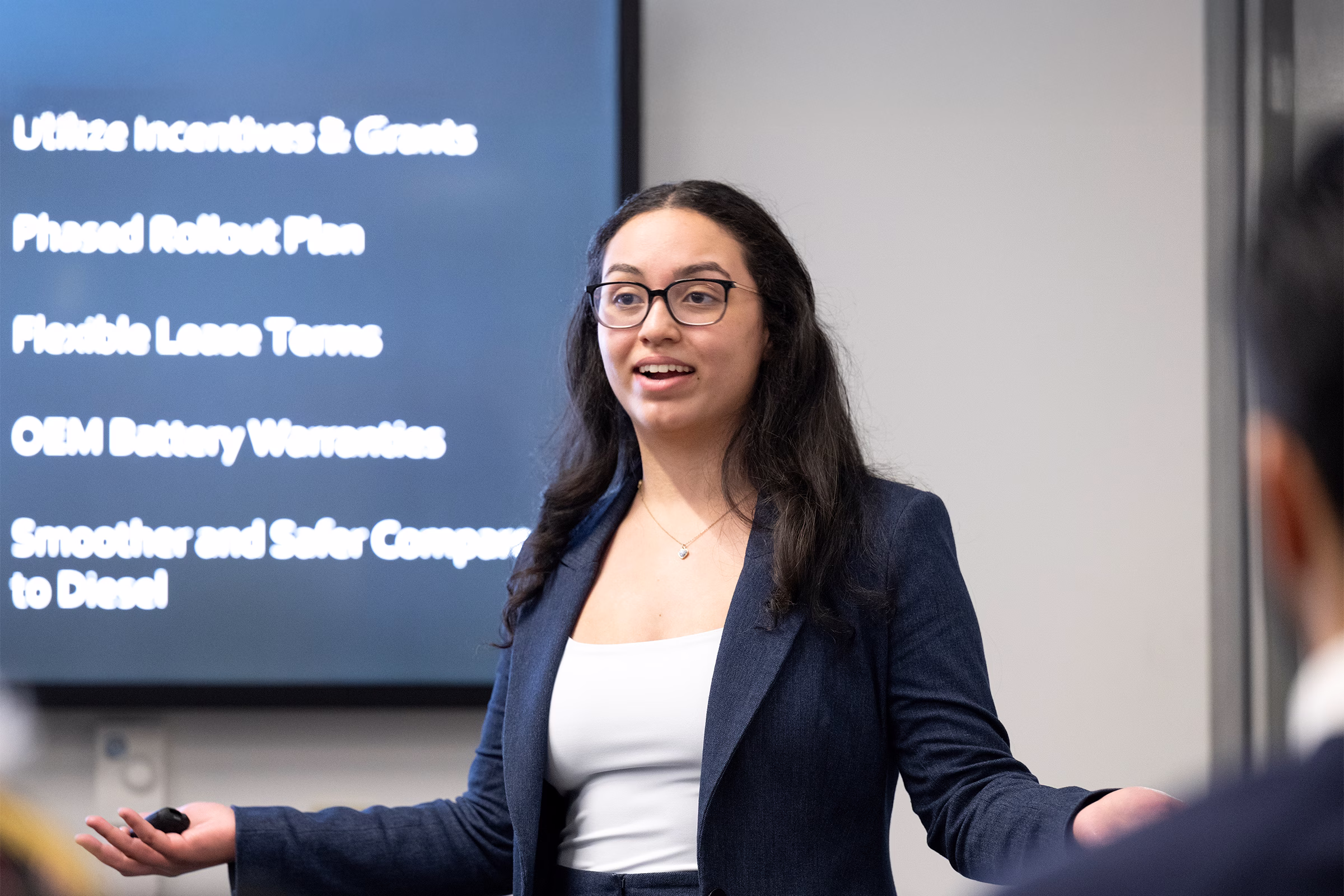 A female student presents to an audience.