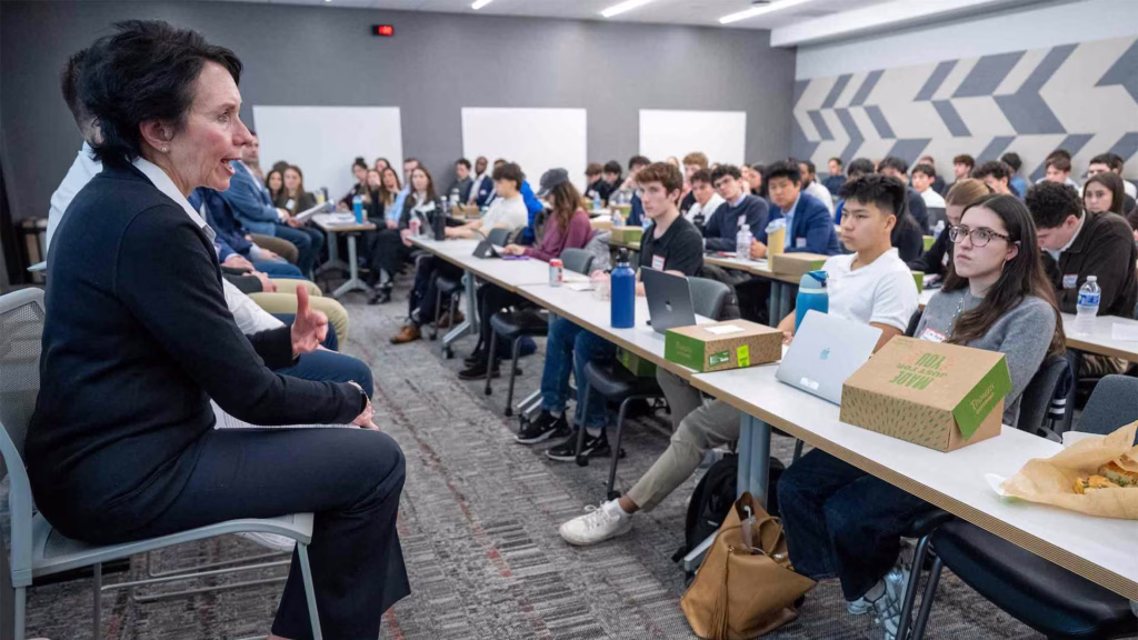 A panel of experts, including WSB's Barb Bolens, speaks to a room of students during the Intro to Wall Street event.