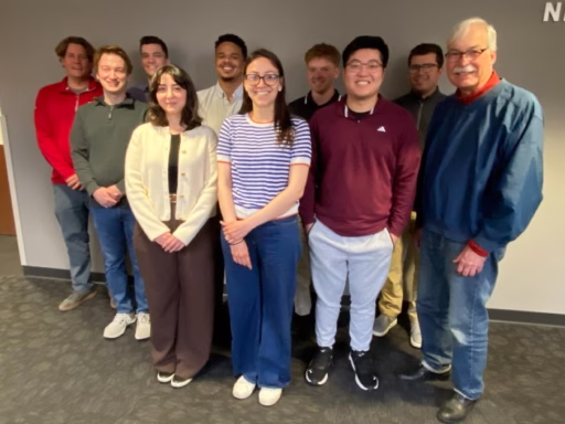 The eight students in this spring's applied learning project pose for a photo with their two faculty leaders.