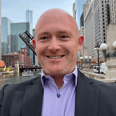 Cody Harper with Chicago street in background.
