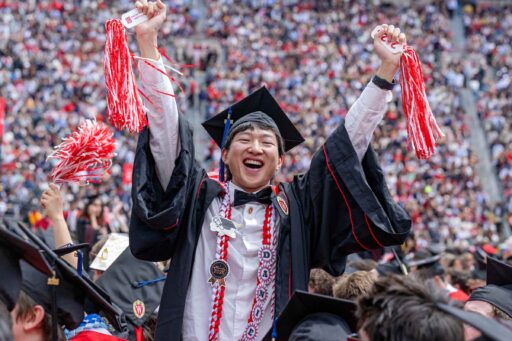 A BBA student celebrates at Camp Randall