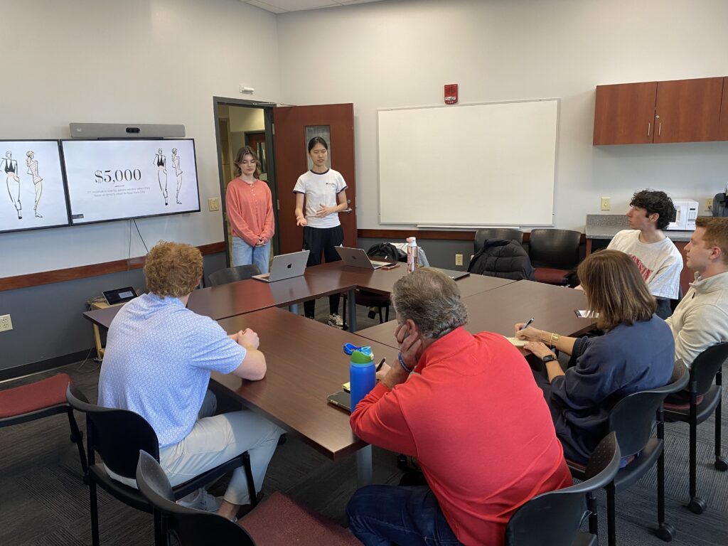 Student Team presenting to judges at Startup Open